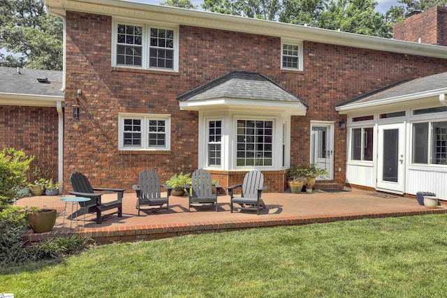 111 Brandon Way, Simpsonville, SC 29681 - rear view of house with a patio area, a lawn, a chimney, and brick siding
