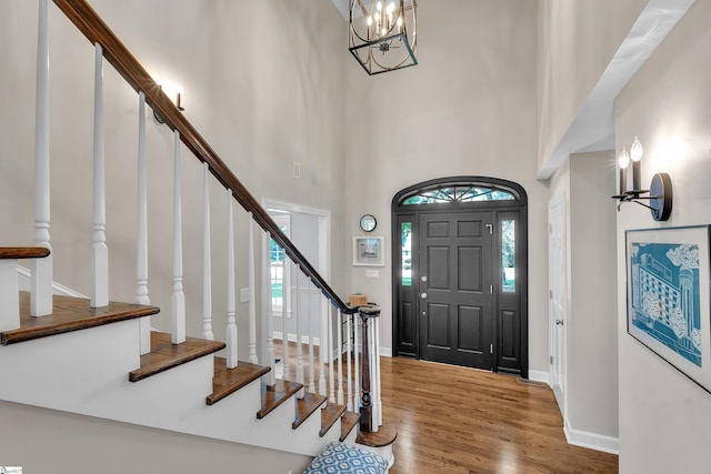 111 Brandon Way, Simpsonville, SC 29681 - foyer entrance featuring a towering ceiling, wood finished floors, stairway, and a chandelier