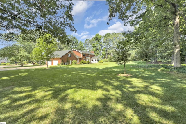 111 Brandon Way, Simpsonville, SC 29681 - view of grassy yard with a garage