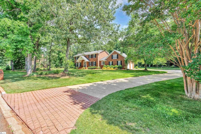 111 Brandon Way, Simpsonville, SC 29681 - colonial home featuring a front lawn, view of wooded area, and brick siding