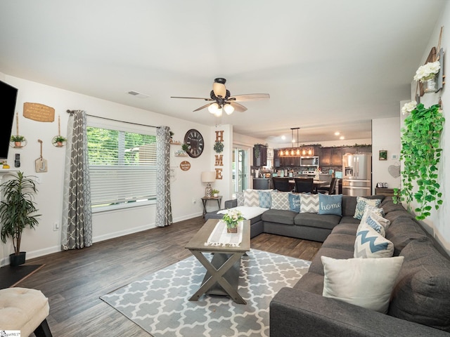 126 Blue Springs Way, Simpsonville, SC 29680 - living area featuring dark wood-style flooring, a ceiling fan, and a chandelier