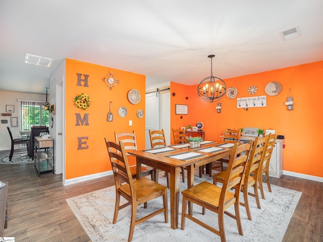126 Blue Springs Way, Simpsonville, SC 29680 - dining room with a barn door, wood finished floors, and a chandelier