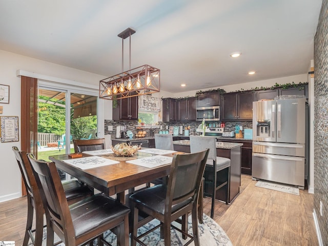 126 Blue Springs Way, Simpsonville, SC 29680 - dining room featuring light wood-style flooring, a chandelier, and recessed lighting