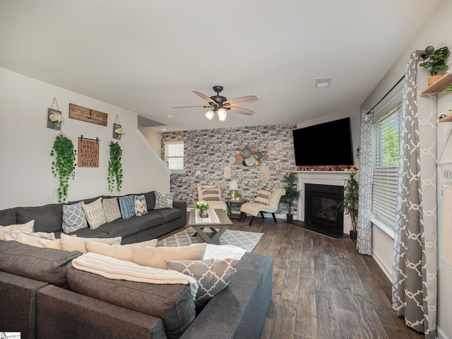 126 Blue Springs Way, Simpsonville, SC 29680 - living area featuring dark wood-style floors, a ceiling fan, and a glass covered fireplace
