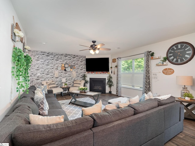 126 Blue Springs Way, Simpsonville, SC 29680 - living room featuring dark wood-style floors, a ceiling fan, and a glass covered fireplace