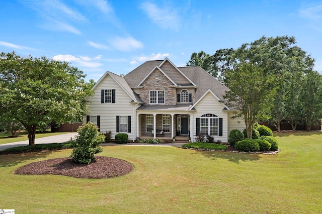 6 Mandarin Cir, Taylors, SC 29687 - view of front of house with stone siding, covered porch, and a front lawn