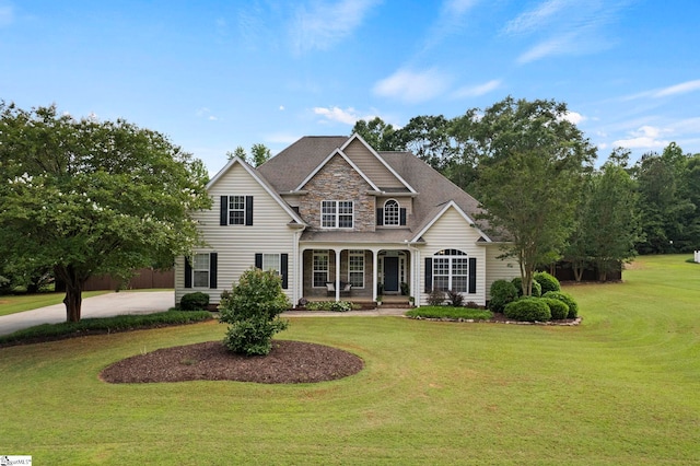 6 Mandarin Cir, Taylors, SC 29687 - traditional home with stone siding, covered porch, a front yard, and driveway