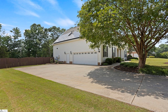 6 Mandarin Cir, Taylors, SC 29687 - view of front of home with roof mounted solar panels, an attached garage, and concrete driveway