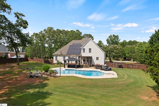 6 Mandarin Cir, Taylors, SC 29687 - back of house featuring a gazebo, roof mounted solar panels, a fenced backyard, a patio, and outdoor lounge area