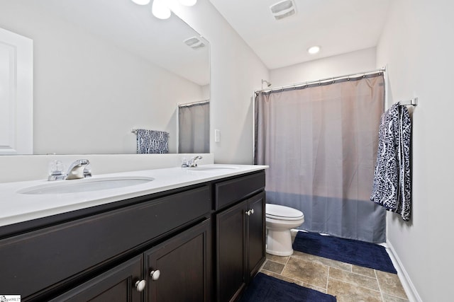 259 Millen Dr, Woodruff, SC 29388 - bathroom featuring stone finish floors, double vanity, and curtained shower