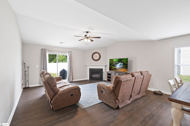 259 Millen Dr, Woodruff, SC 29388 - living room with dark wood-style floors, a fireplace with flush hearth, a ceiling fan, and vaulted ceiling