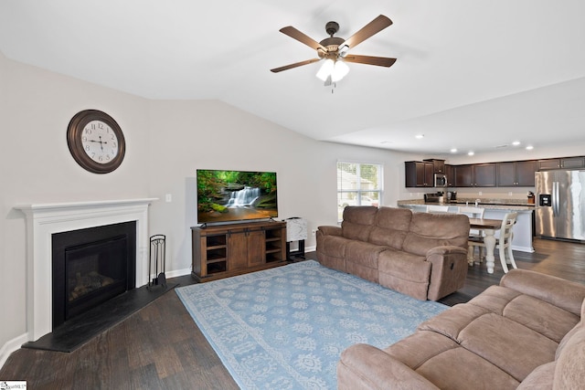 259 Millen Dr, Woodruff, SC 29388 - living room with a ceiling fan, dark wood-style flooring, vaulted ceiling, recessed lighting, and a glass covered fireplace