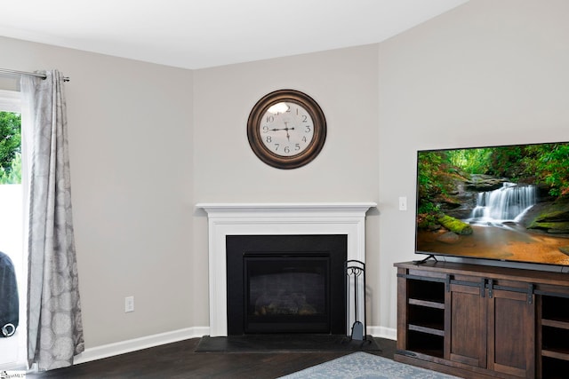 259 Millen Dr, Woodruff, SC 29388 - living area with dark wood finished floors and a fireplace with flush hearth