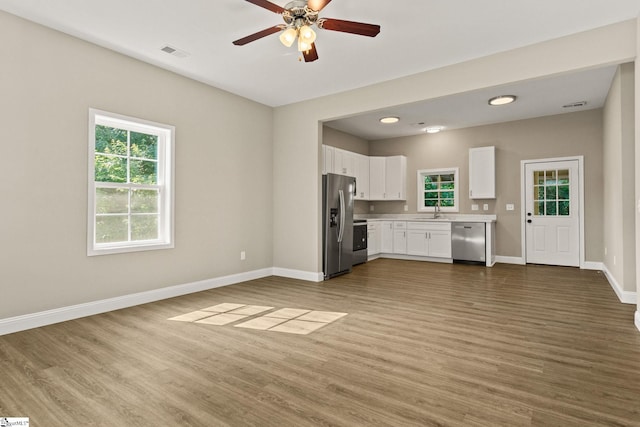 1231 Apalache St, Greer, SC 29651 - kitchen featuring stainless steel appliances, wood finished floors, light countertops, and recessed lighting