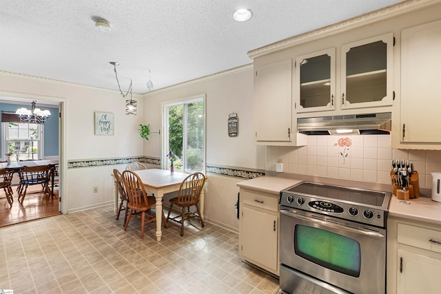 217 Devenger Rd, Greer, SC 29650 - kitchen featuring stainless steel electric stove, extractor fan, healthy amount of natural light, light countertops, and a textured ceiling