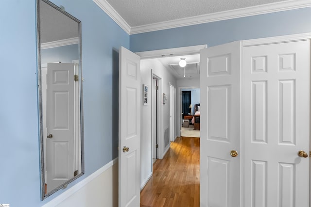 217 Devenger Rd, Greer, SC 29650 - corridor featuring attic access, ornamental molding, wood finished floors, and a textured ceiling