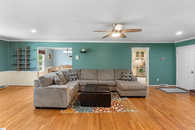 217 Devenger Rd, Greer, SC 29650 - living area featuring wood finished floors, a chandelier, ornamental molding, ceiling fan, and recessed lighting