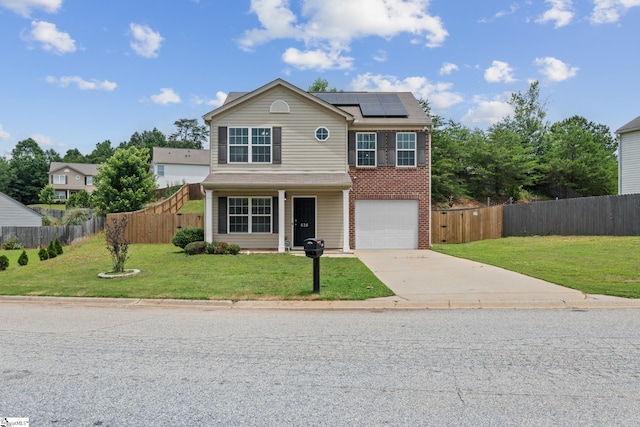 626 Duncan Station Dr, Duncan, SC 29334 - traditional-style house with solar panels, driveway, an attached garage, and brick siding