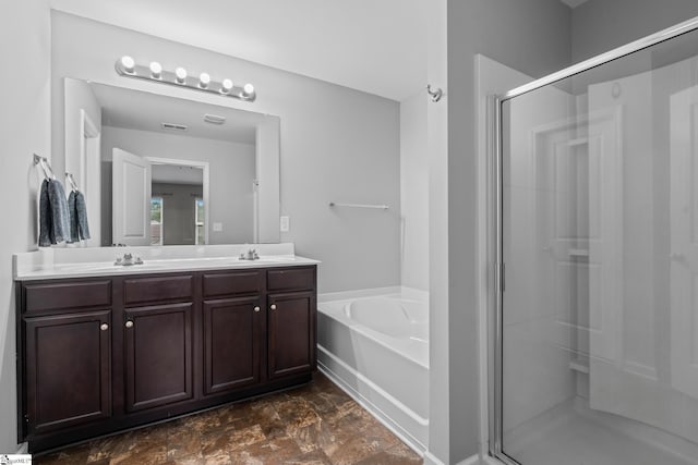 626 Duncan Station Dr, Duncan, SC 29334 - bathroom featuring a stall shower, double vanity, a garden tub, and stone finish floors