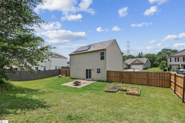 626 Duncan Station Dr, Duncan, SC 29334 - back of house featuring a fire pit, a vegetable garden, and a fenced backyard