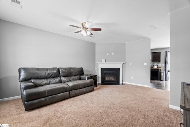 626 Duncan Station Dr, Duncan, SC 29334 - living area featuring carpet, a ceiling fan, and a fireplace with flush hearth
