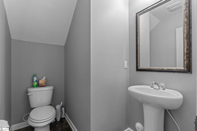 626 Duncan Station Dr, Duncan, SC 29334 - half bathroom featuring toilet and lofted ceiling