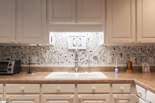 110 Baldwin Pl, Easley, SC 29642 - kitchen with backsplash, light countertops, and white cabinetry