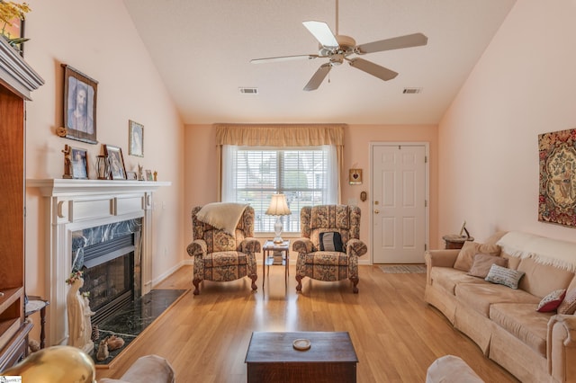 110 Baldwin Pl, Easley, SC 29642 - living area featuring vaulted ceiling, a high end fireplace, a ceiling fan, and wood finished floors