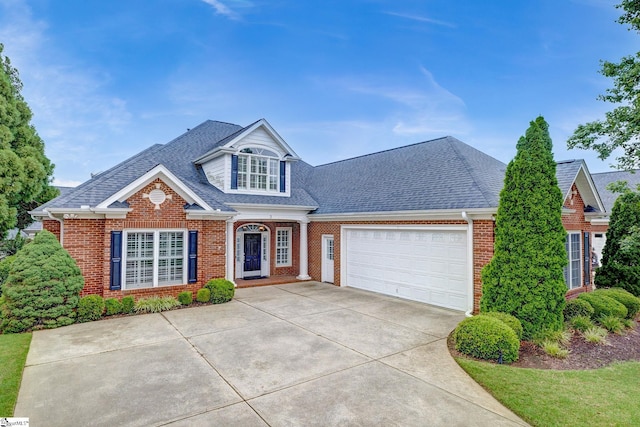 3 Henson Pl, Greer, SC 29650 - traditional-style home featuring brick siding, roof with shingles, concrete driveway, and an attached garage