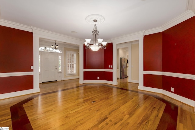 3 Henson Pl, Greer, SC 29650 - unfurnished dining area featuring a chandelier, wood finished floors, and crown molding