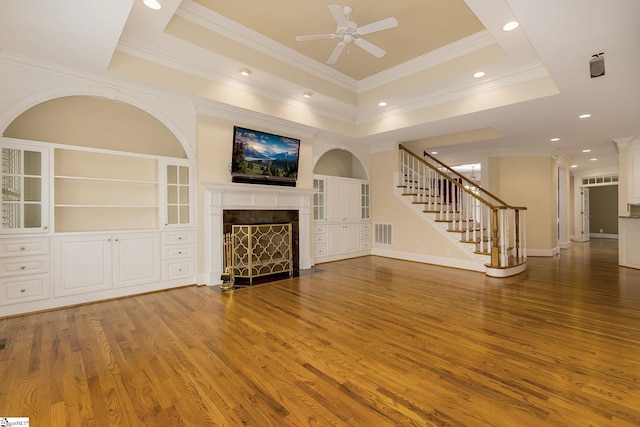 3 Henson Pl, Greer, SC 29650 - unfurnished living room featuring stairs, a ceiling fan, a fireplace, crown molding, and wood finished floors