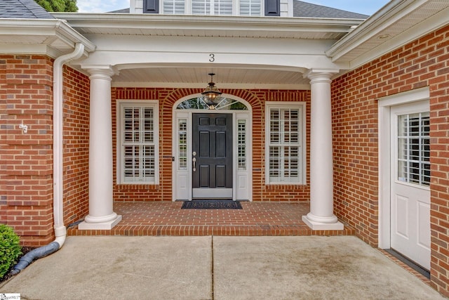 3 Henson Pl, Greer, SC 29650 - doorway to property featuring brick siding, covered porch, and roof with shingles