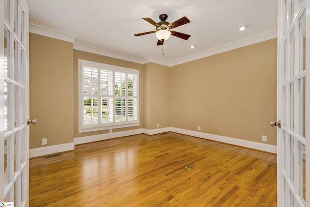 3 Henson Pl, Greer, SC 29650 - spare room with light wood-type flooring, french doors, ornamental molding, and ceiling fan