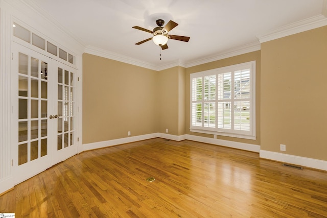 3 Henson Pl, Greer, SC 29650 - empty room featuring french doors, wood finished floors, ornamental molding, and a ceiling fan