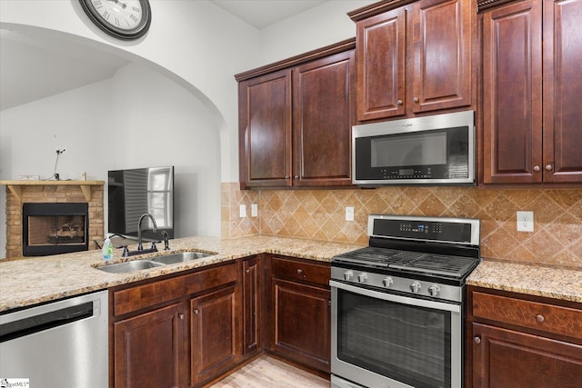 505 E Czardas Way, Woodruff, SC 29375 - kitchen with stainless steel appliances, light stone counters, and decorative backsplash
