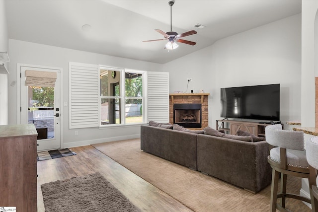505 E Czardas Way, Woodruff, SC 29375 - living area with lofted ceiling, a ceiling fan, a fireplace, and wood finished floors