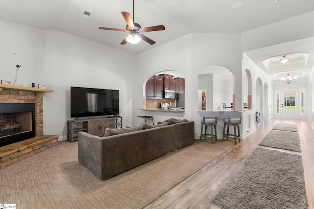 505 E Czardas Way, Woodruff, SC 29375 - living area featuring light wood-style floors, a fireplace, ceiling fan, a chandelier, and vaulted ceiling