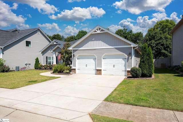 505 E Czardas Way, Woodruff, SC 29375 - view of front of property with board and batten siding, an attached garage, and driveway