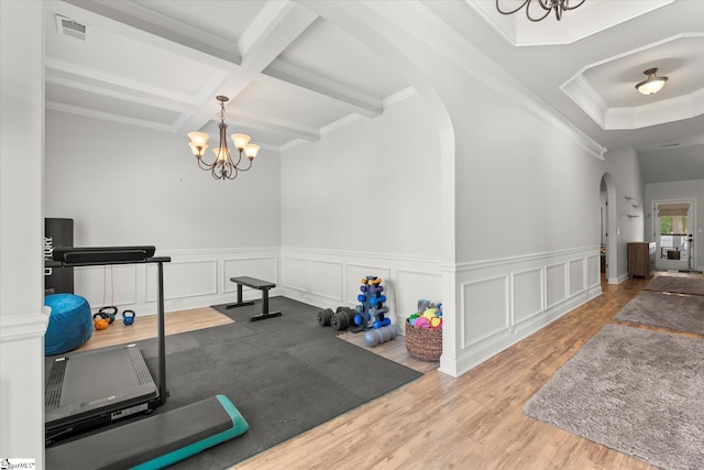 505 E Czardas Way, Woodruff, SC 29375 - exercise room with arched walkways, a chandelier, wood finished floors, crown molding, and coffered ceiling