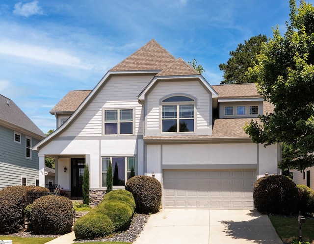 101 Stonewash Way, Greer, SC 29650 - view of front of home with a shingled roof, concrete driveway, stucco siding, and a garage