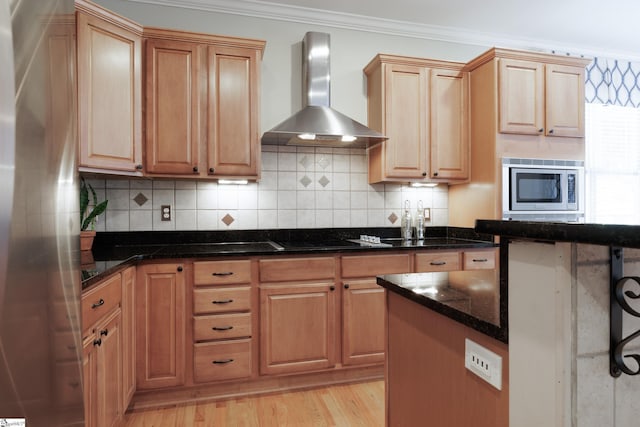 101 Stonewash Way, Greer, SC 29650 - kitchen with wall chimney exhaust hood, stainless steel microwave, crown molding, backsplash, and black electric stovetop