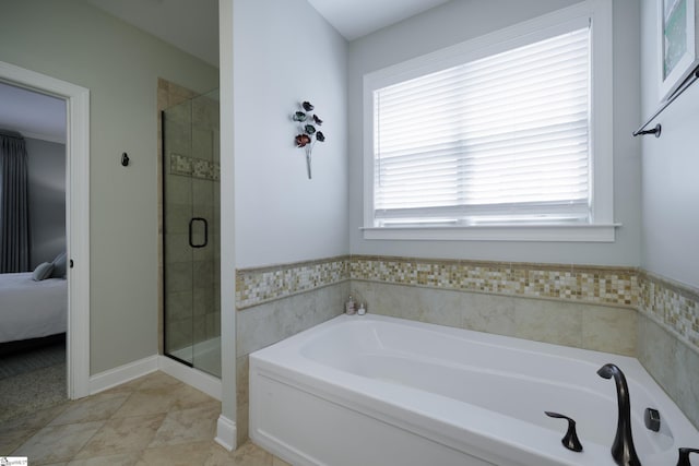 101 Stonewash Way, Greer, SC 29650 - bathroom featuring a garden tub, a stall shower, healthy amount of natural light, and ensuite bathroom