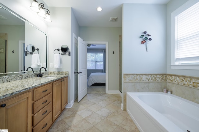 101 Stonewash Way, Greer, SC 29650 - ensuite bathroom featuring vanity, a garden tub, a shower with door, tile patterned floors, and recessed lighting