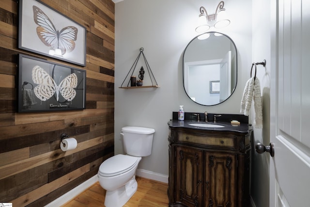 101 Stonewash Way, Greer, SC 29650 - half bathroom with wood walls, vanity, and wood finished floors