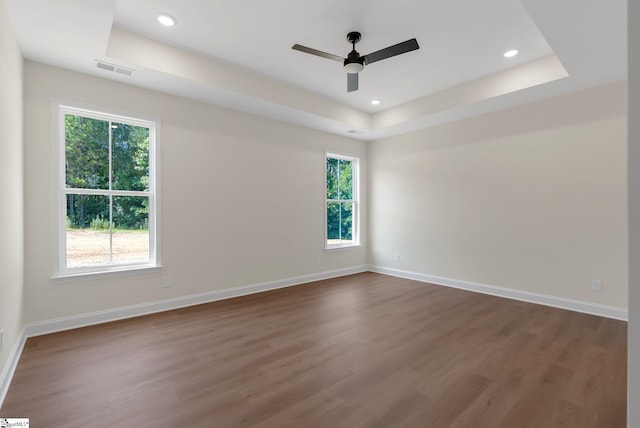 293 Pine Hills Rd, Woodruff, SC 29388 - empty room with a raised ceiling, dark wood-style floors, a ceiling fan, and recessed lighting