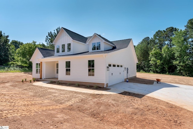 293 Pine Hills Rd, Woodruff, SC 29388 - modern inspired farmhouse with driveway, an attached garage, and a shingled roof
