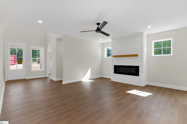 293 Pine Hills Rd, Woodruff, SC 29388 - unfurnished living room featuring dark wood-style floors, a large fireplace, a ceiling fan, and recessed lighting