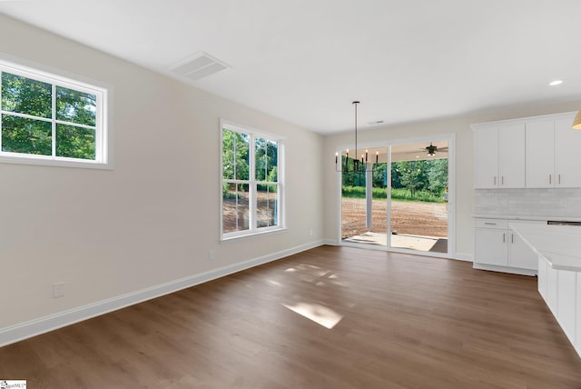 293 Pine Hills Rd, Woodruff, SC 29388 - unfurnished dining area featuring healthy amount of natural light, dark wood-style floors, a chandelier, and recessed lighting
