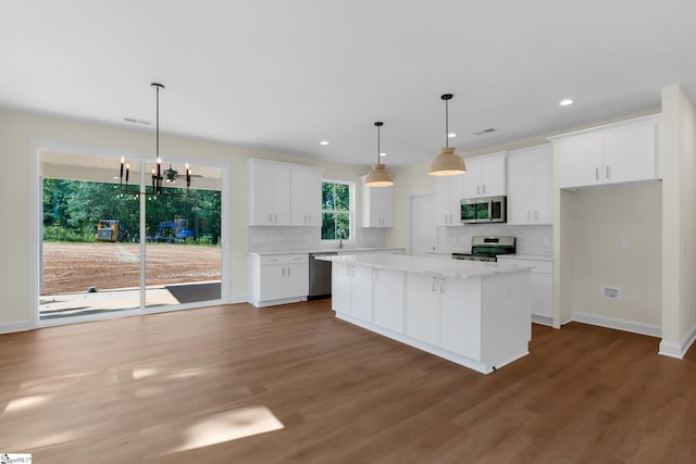 293 Pine Hills Rd, Woodruff, SC 29388 - kitchen featuring appliances with stainless steel finishes, tasteful backsplash, white cabinetry, light countertops, and recessed lighting