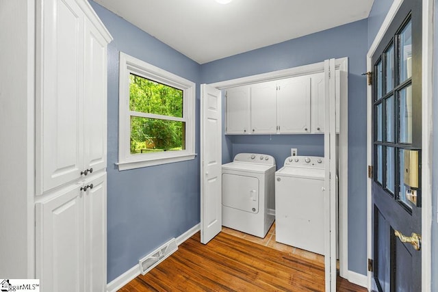 111 Bonwood Ave, Simpsonville, SC 29681 - laundry area with cabinet space, separate washer and dryer, and dark wood-style floors